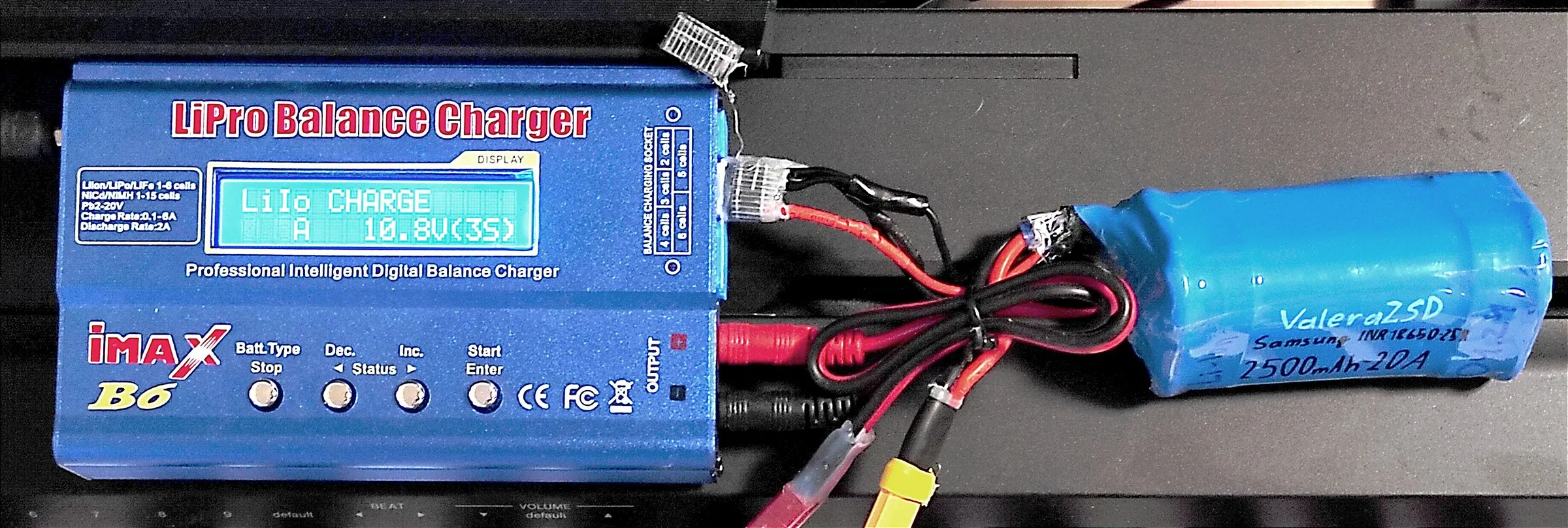 an iMAX B6 charger showing LiIo CHARGE 10.8V(3S), connected to a blue battery pack hand-labelled ValeraZSD, Samsung INR18650-25R, 2500mAh-20A